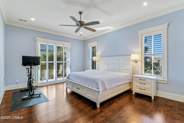 bedroom with dark wood-type flooring, multiple windows, baseboards, and visible vents