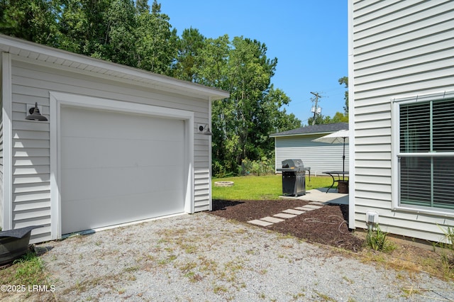 garage featuring driveway