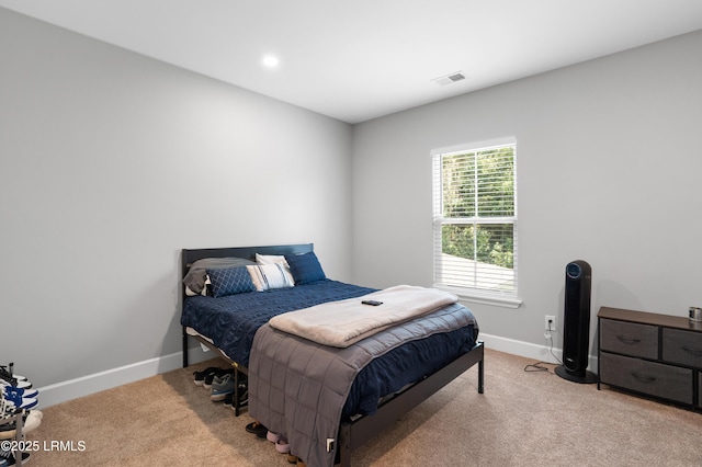 bedroom with baseboards, visible vents, and carpet flooring