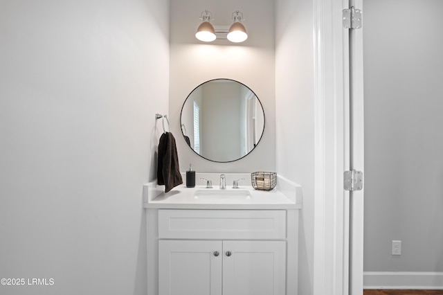 bathroom featuring vanity and baseboards