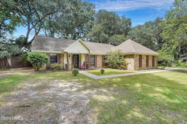 single story home featuring a front yard