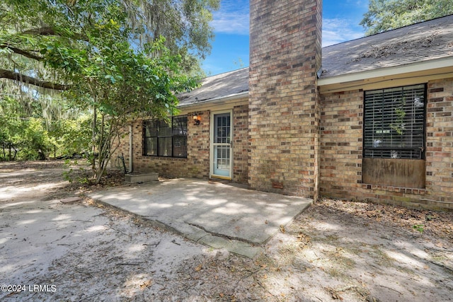 rear view of property featuring a patio