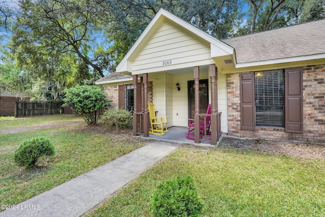 bungalow-style house featuring a front yard