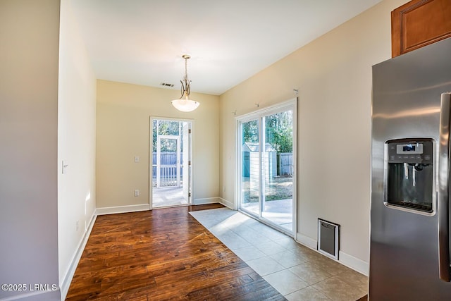 doorway to outside with light wood-type flooring