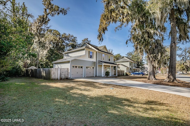 view of front facade featuring a garage and a front lawn