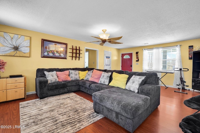 living room with hardwood / wood-style flooring and a textured ceiling