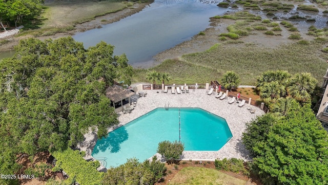 aerial view of a pool and a large body of water