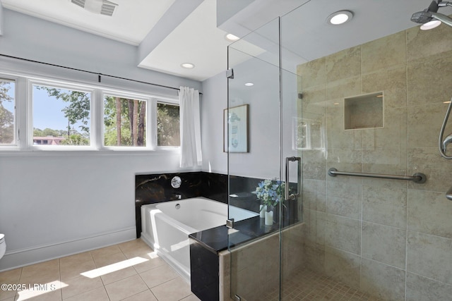 full bathroom with tile patterned floors, a bath, a stall shower, recessed lighting, and baseboards