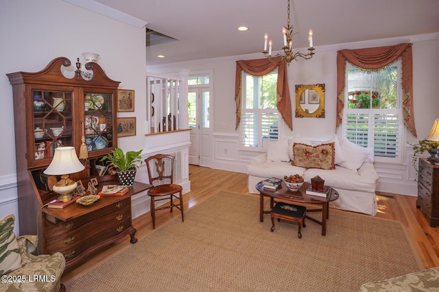 58 Wrights Point Cir, Beaufort, SC 29902 - living room with a chandelier, light wood-style floors, a decorative wall, and recessed lighting