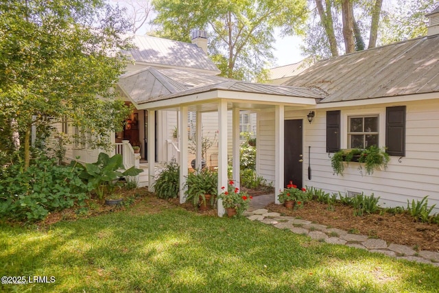 58 Wrights Point Cir, Beaufort, SC 29902 - ranch-style home with a front yard, a metal roof, and a chimney