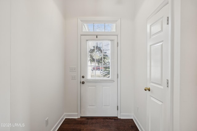 entryway with dark wood-type flooring and baseboards