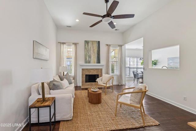 living room with visible vents, baseboards, recessed lighting, wood finished floors, and a ceiling fan