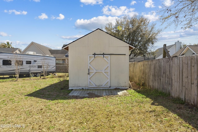 view of shed featuring a fenced backyard