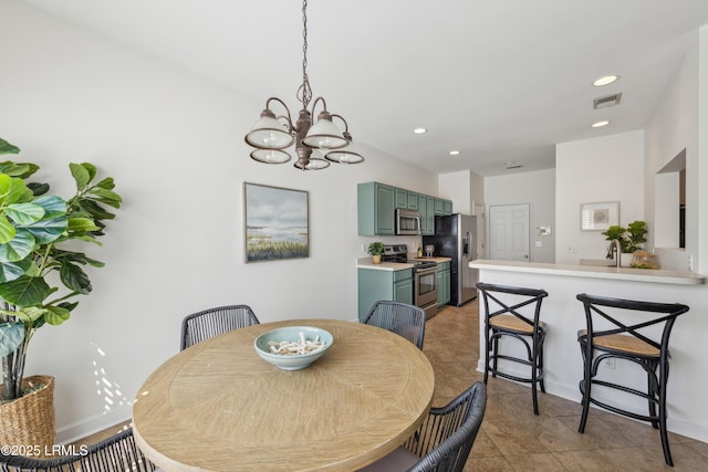 dining room with baseboards, recessed lighting, visible vents, and a chandelier