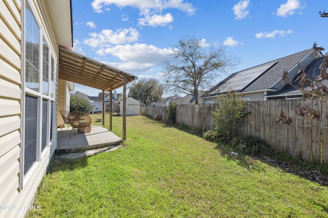 view of yard featuring a patio and a fenced backyard