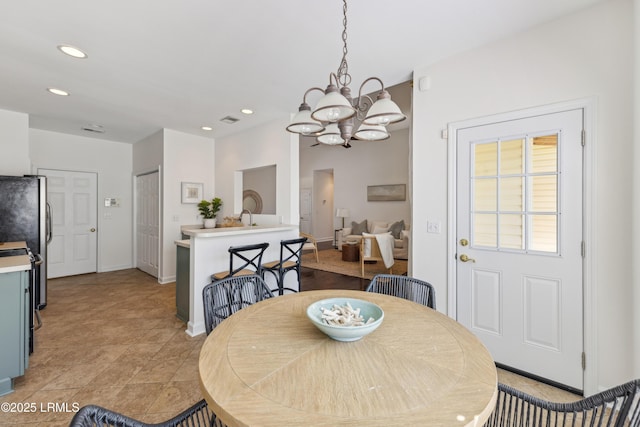 dining room with visible vents, recessed lighting, baseboards, and an inviting chandelier