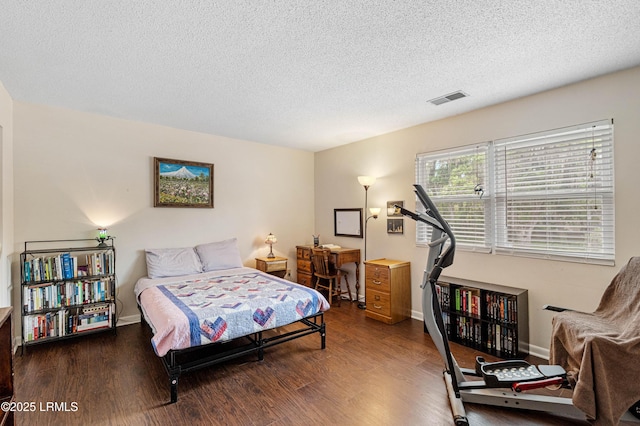 900 Brotherhood Rd Unit D2, Beaufort, SC 29902 - bedroom with visible vents, baseboards, wood finished floors, and a textured ceiling