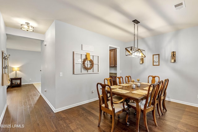 109 Patriot Ct, Beaufort, SC 29906 - dining space featuring dark wood-type flooring and baseboards