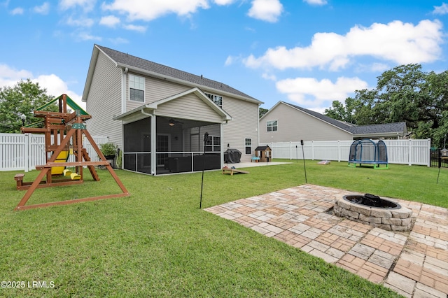 109 Patriot Ct, Beaufort, SC 29906 - back of house featuring a playground, a trampoline, a patio, a fire pit, and a sunroom