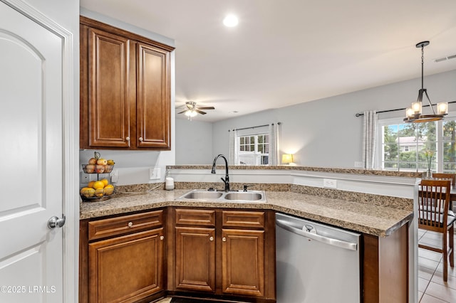 109 Patriot Ct, Beaufort, SC 29906 - kitchen with dishwasher, a sink, a peninsula, healthy amount of natural light, and recessed lighting