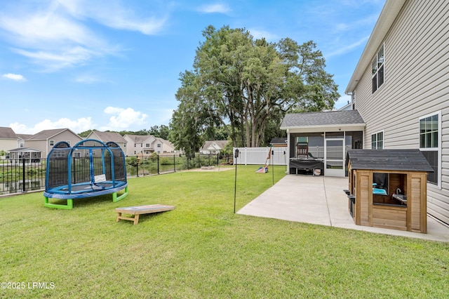 109 Patriot Ct, Beaufort, SC 29906 - view of yard featuring a trampoline, a patio, a sunroom, and a residential view