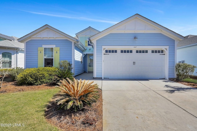 view of front facade with board and batten siding, concrete driveway, and a garage