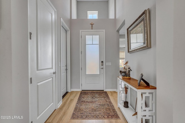 267 Cool Breeze Dr, Hardeeville, SC 29927 - foyer with light wood-style floors, a towering ceiling, and baseboards
