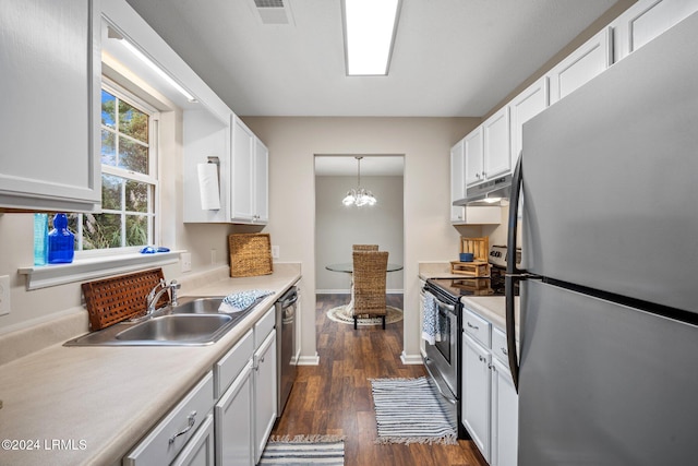 kitchen with visible vents, under cabinet range hood, a sink, stainless steel appliances, and light countertops