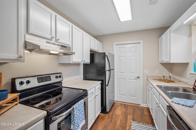 kitchen featuring under cabinet range hood, dark wood-type flooring, appliances with stainless steel finishes, and white cabinets