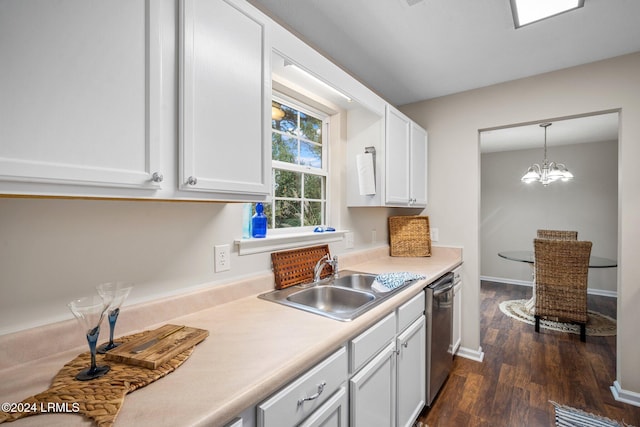 kitchen featuring a sink, stainless steel dishwasher, white cabinetry, light countertops, and dark wood-style flooring