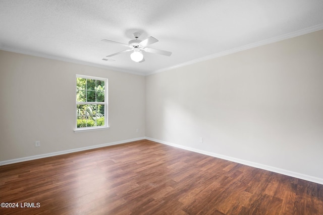 spare room with baseboards, wood finished floors, and a ceiling fan