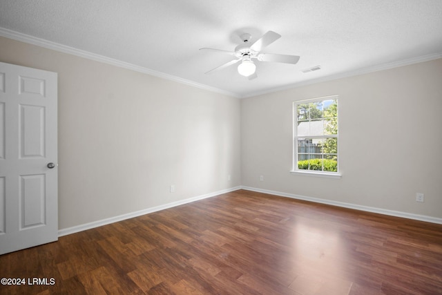 empty room featuring wood finished floors, a ceiling fan, baseboards, and visible vents