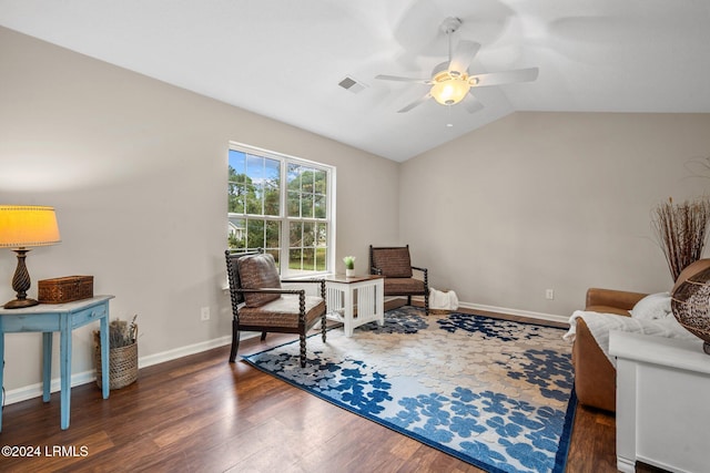 sitting room featuring visible vents, baseboards, lofted ceiling, wood finished floors, and a ceiling fan