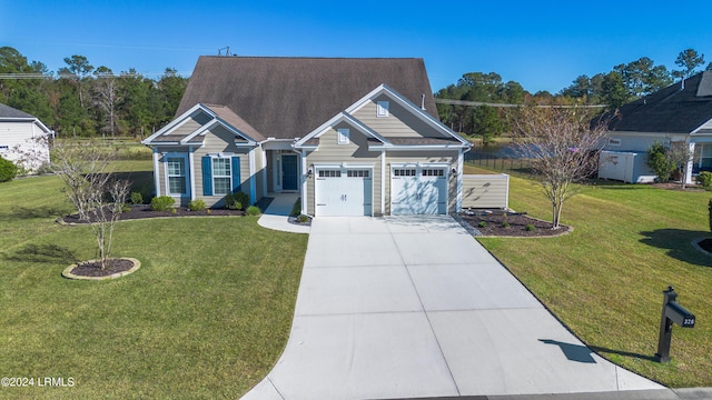 view of front of home with a garage and a front lawn