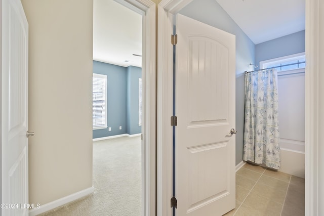 bathroom featuring shower / bath combo with shower curtain