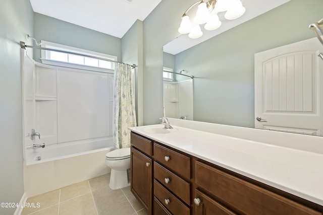 full bathroom with tile patterned flooring, vanity, a notable chandelier, toilet, and shower / bath combo with shower curtain