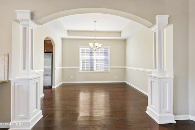 unfurnished dining area featuring dark hardwood / wood-style flooring