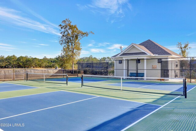 view of sport court featuring basketball hoop