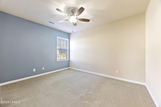 unfurnished room featuring carpet flooring and ceiling fan