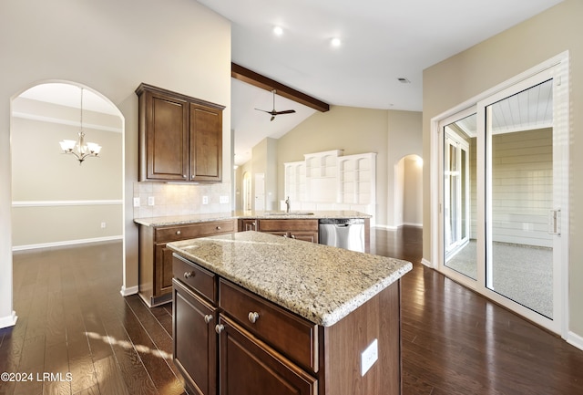 kitchen with tasteful backsplash, dishwasher, sink, a center island, and kitchen peninsula