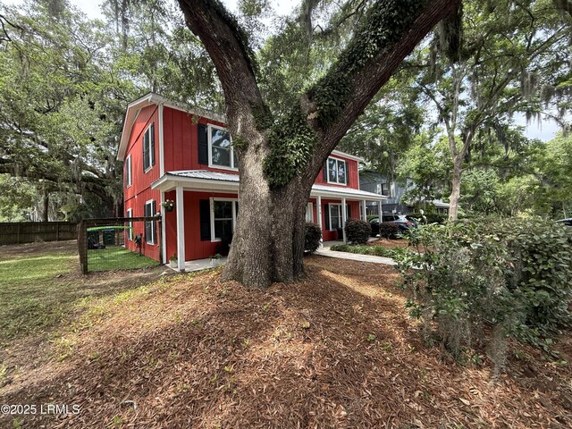 814 14th St, Port Royal, SC 29935 - kitchen with a sink, light stone counters, and stainless steel appliances