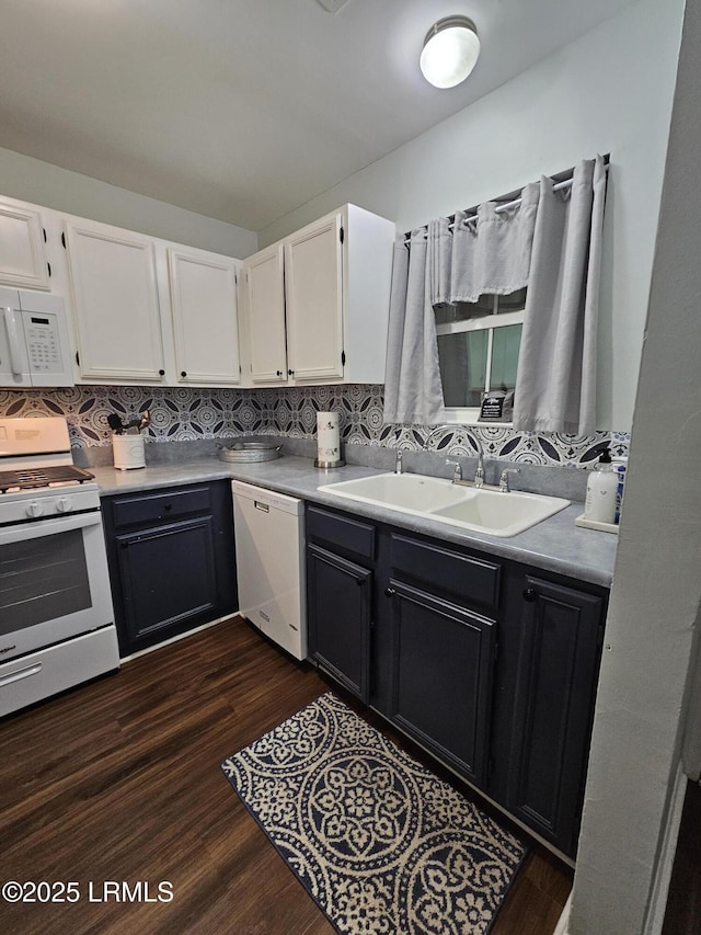 814 14th St, Port Royal, SC 29935 - kitchen featuring a sink, white cabinets, white appliances, and decorative backsplash