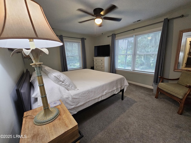 814 14th St, Port Royal, SC 29935 - bedroom with dark carpet, visible vents, baseboards, and a textured ceiling