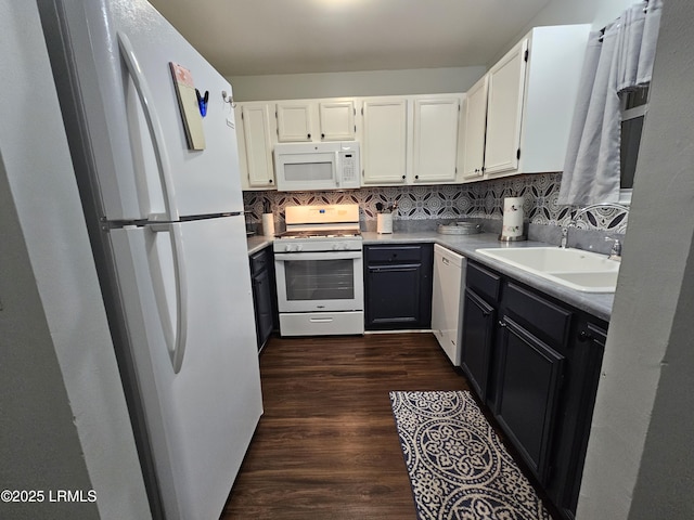 814 14th St, Port Royal, SC 29935 - kitchen with decorative backsplash, white cabinetry, and white appliances