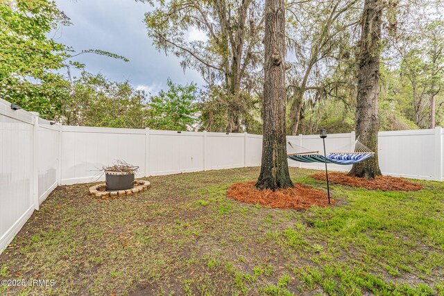 view of yard with a fenced backyard