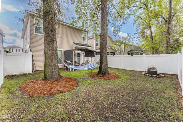 view of yard with a fenced backyard