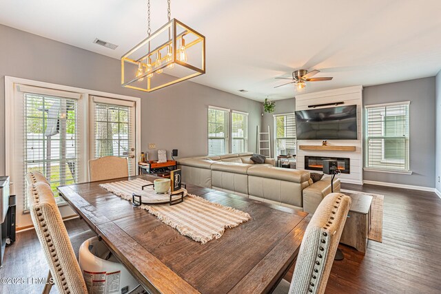 dining space with visible vents, dark wood-style floors, and a healthy amount of sunlight