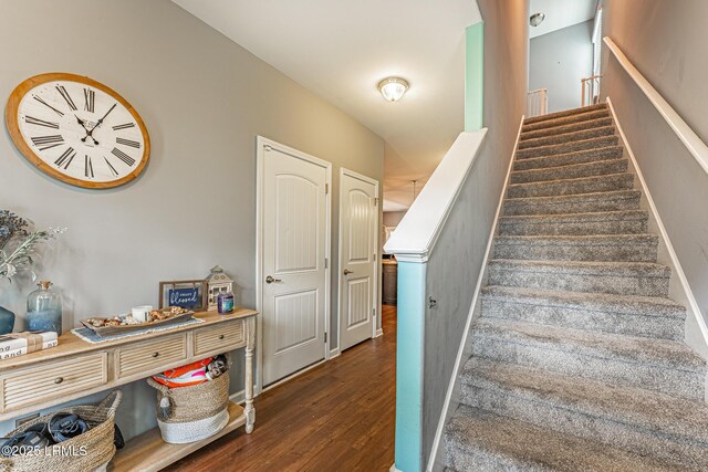 stairway with wood finished floors