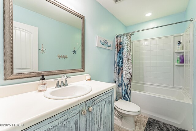 bathroom featuring toilet, shower / tub combo with curtain, and vanity