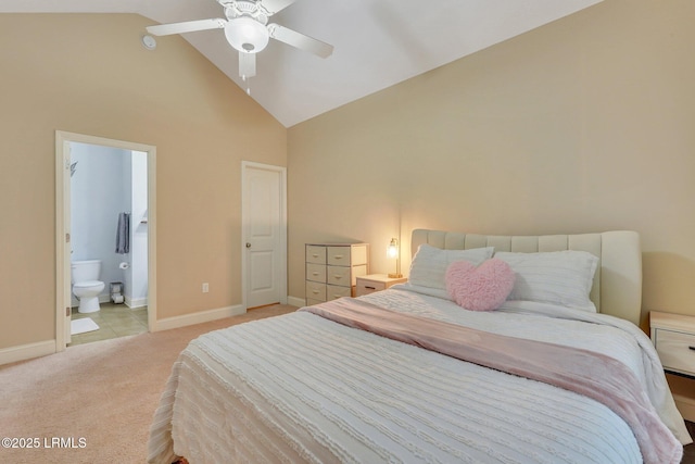 carpeted bedroom featuring vaulted ceiling, ceiling fan, and ensuite bathroom